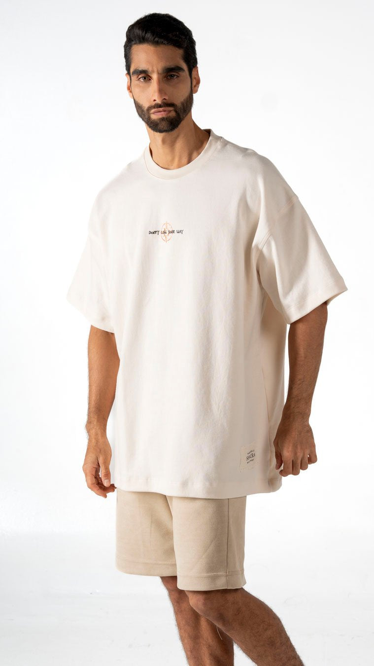 Loose oversized white t-shirt with "Don't Like Your Way" graphic and small logo, casual streetwear style, men's clothing for trendy fashion, comfortable everyday outfit.