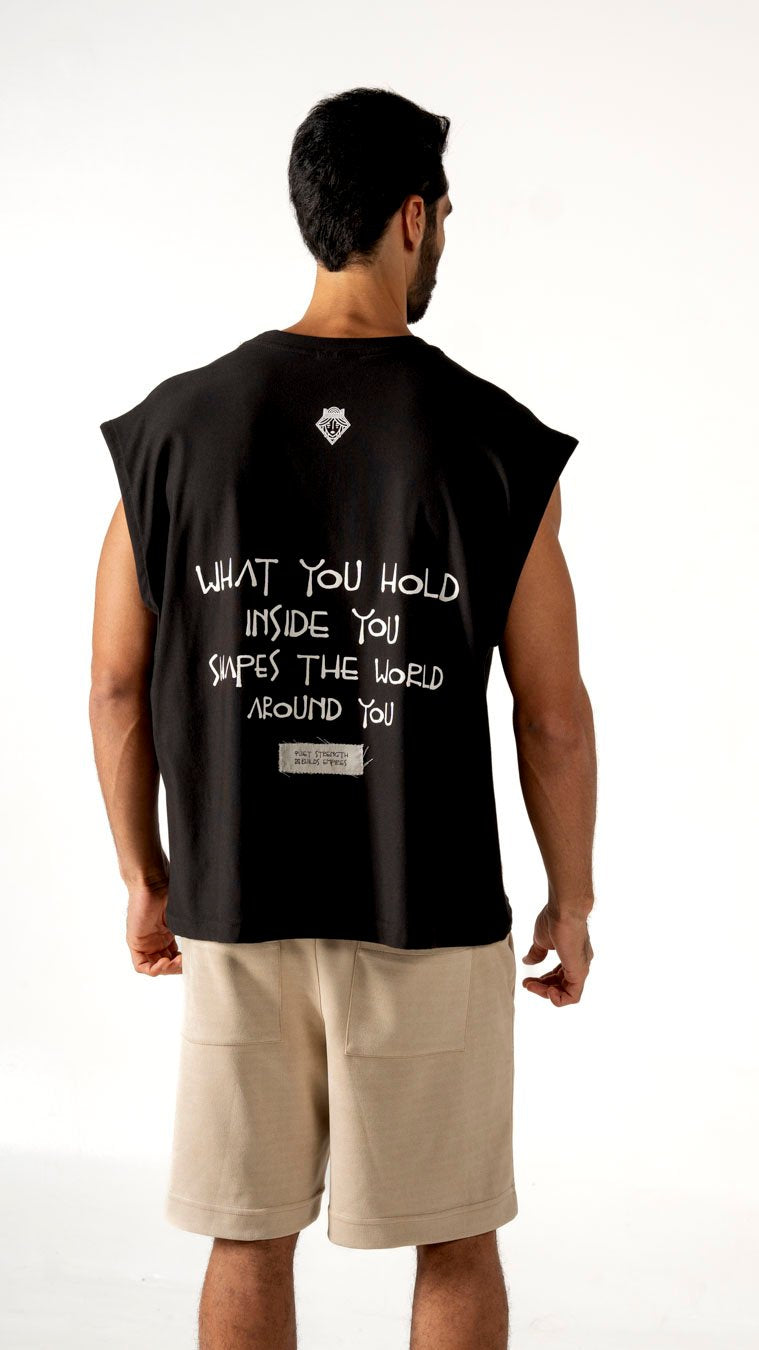 Reflective black sleeveless top with quote "What you hold inside you shapes the world around you" and a small patch reading "Point Strength". Perfect for casual wear and expressive street style.