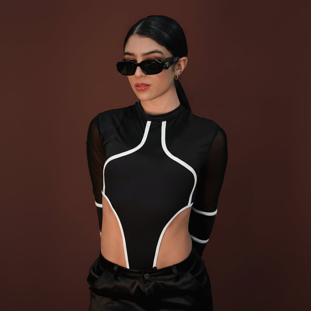 Black designer sunglasses with bold frames and logo detail.