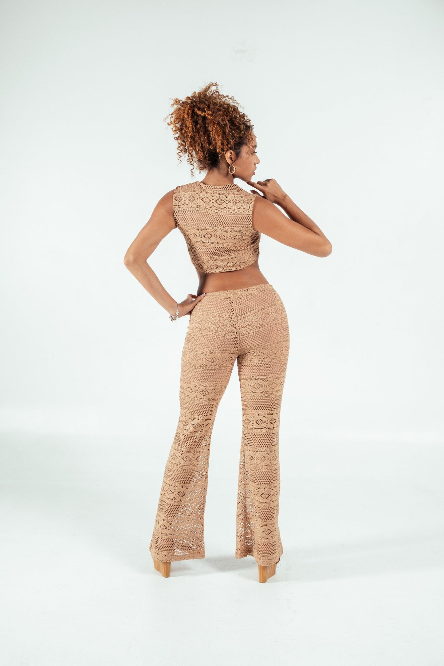 Intricate beige crochet lace pants and matching crop top, stylish boho chic outfit, perfect for summer fashion, boutique clothing, and sustainable wardrobe options.