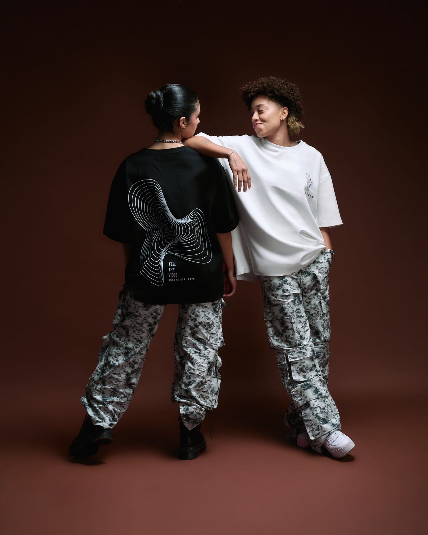 Comfortable streetwear casual outfits featuring graphic t-shirts with modern designs, paired with camouflage cargo pants for a bold urban style, perfect for fashion-forward lifestyles.