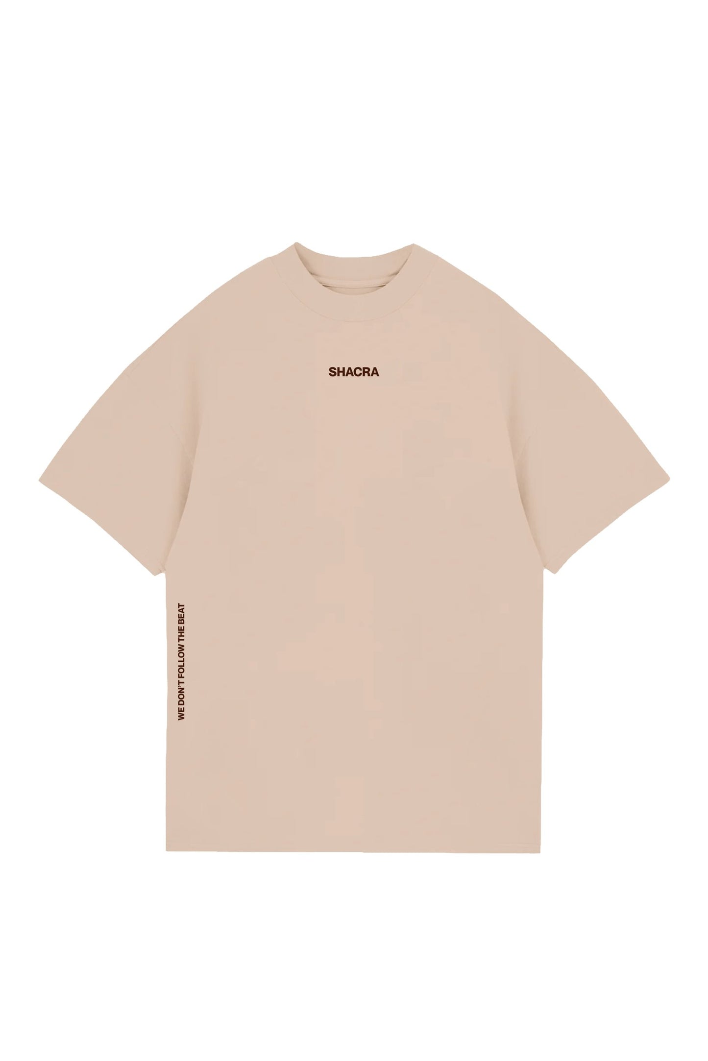Comfortable beige T-shirt with "SHACRA" logo on the chest and motivational phrase "WE DON'T FOLLOW THE BEAT" on the side. Perfect casual wear for music and lifestyle enthusiasts.