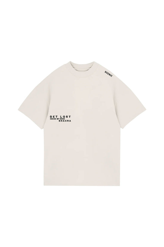 Minimalist white T-shirt featuring black printed text "GET LOST INSIDE MY MIND SHACRA" on the front, with "SCENIC" printed on the shoulder, showcasing modern streetwear style from Shacra.