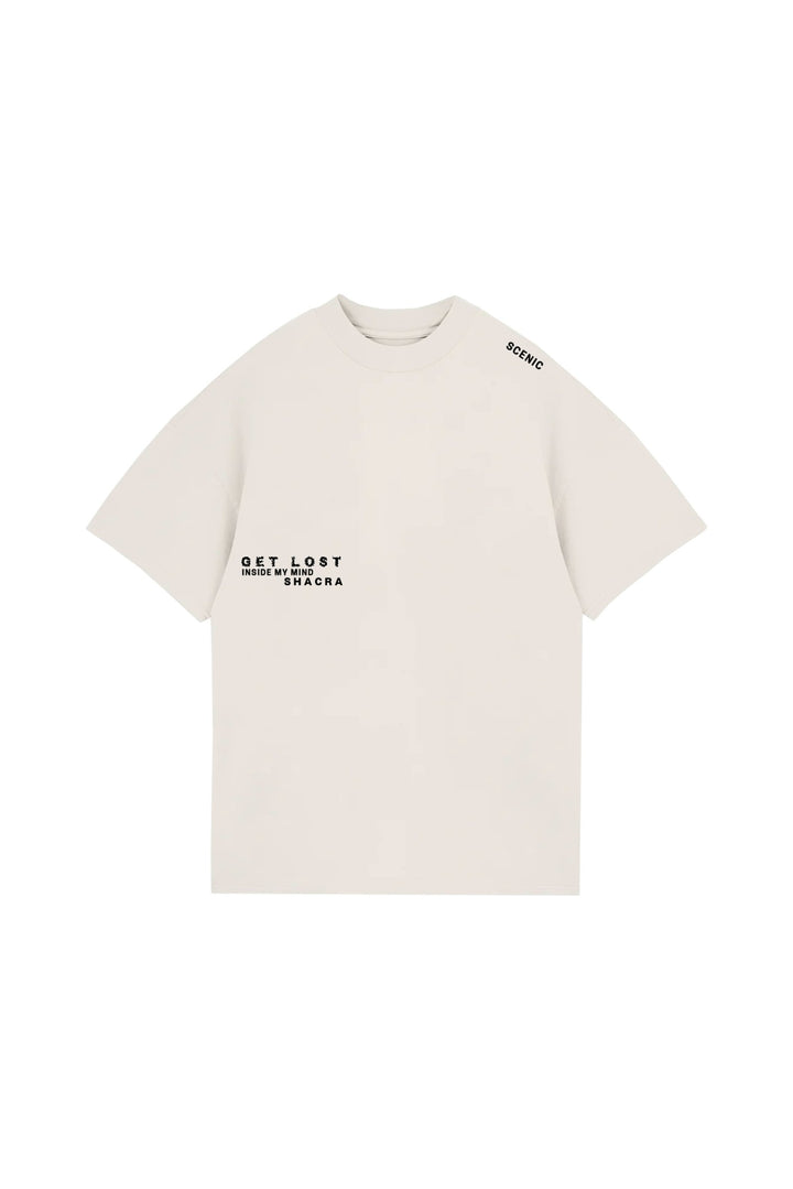Minimalist white T-shirt featuring black printed text "GET LOST INSIDE MY MIND SHACRA" on the front, with "SCENIC" printed on the shoulder, showcasing modern streetwear style from Shacra.