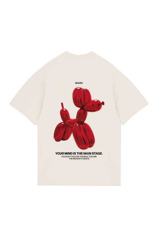 Vibrant red balloon dog graphic on a white t-shirt, featuring bold black text and an inspiring quote about creativity and mindset. Unique streetwear design blending art and fashion by Shacra.