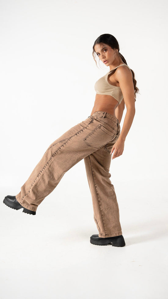 Wide-leg beige jeans paired with a tan crop top, showcasing casual and trendy fashion styles for women. Perfect for streetwear or relaxed outings, emphasizing comfort and style.