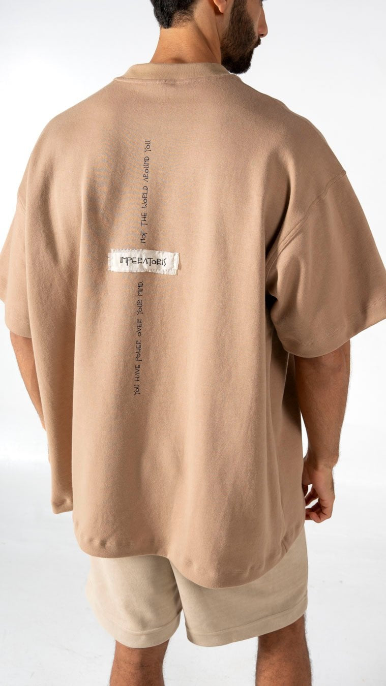 Soft beige oversized T-shirt with black text and "IMPERATORS" label, casual streetwear style, perfect for modern men's fashion, by Shacra.