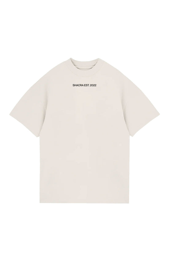 Luxurious cream crewneck t-shirt with "SHACRA EST. 2022" printed on the chest, perfect for streetwear fashion, casual outings, and making a stylish statement.