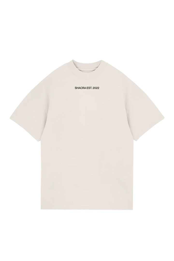 Luxurious cream crewneck t-shirt with "SHACRA EST. 2022" printed on the chest, perfect for streetwear fashion, casual outings, and making a stylish statement.