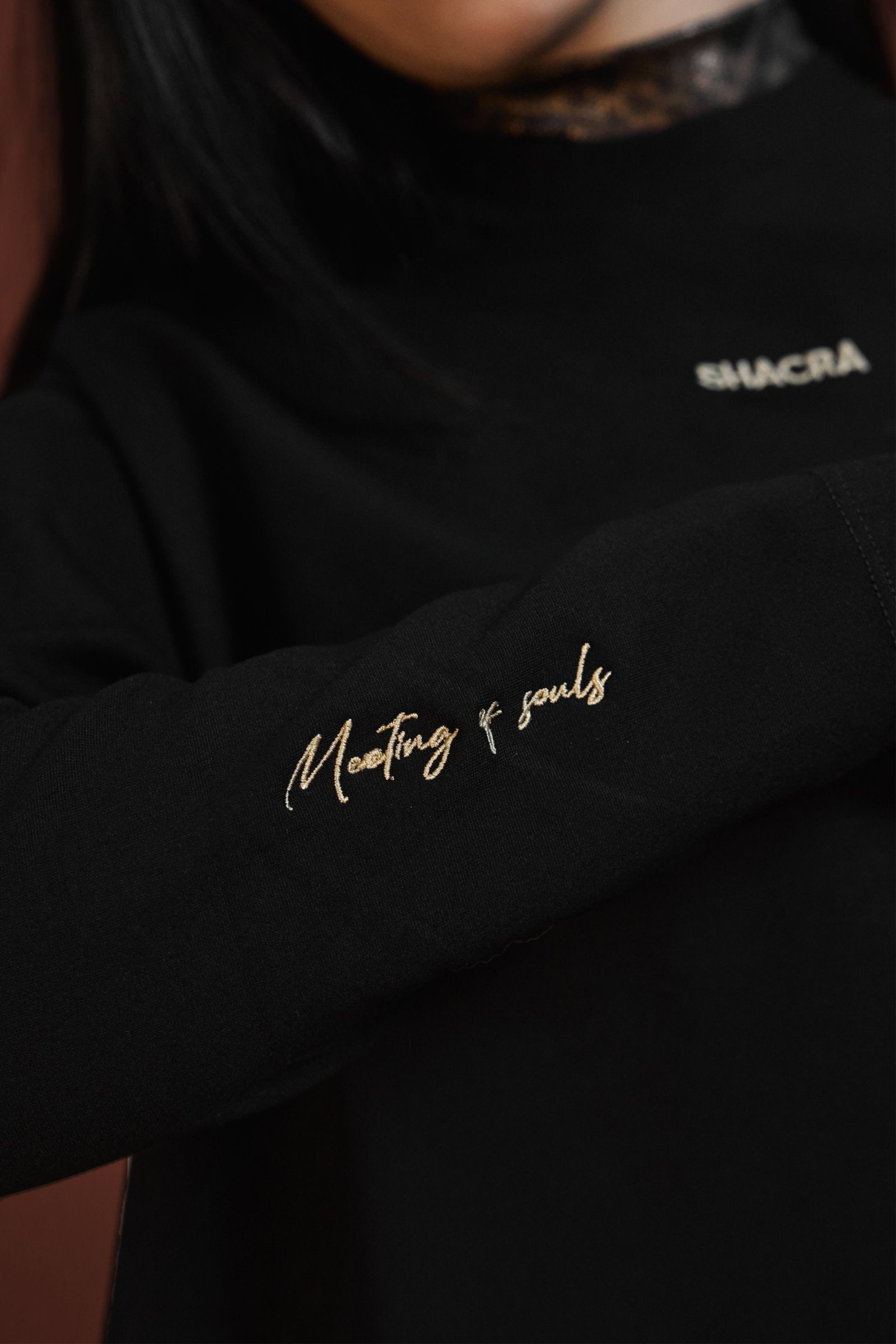 Makeup of souls embroidered black sweatshirt with inspirational message and brand logo, fashion statement, casual comfort, modern style, and unique design.