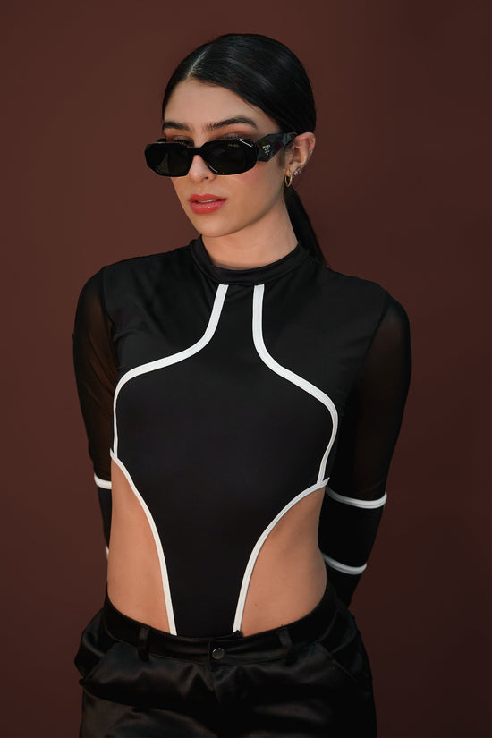 Black designer sunglasses with bold frames and logo detail.