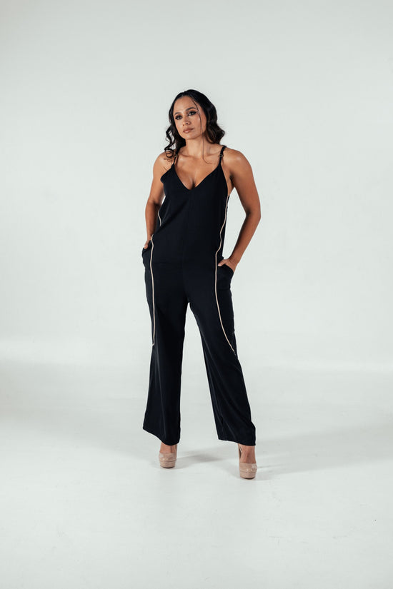 Elegant black jumpsuit with gold piping for women, stylish and versatile fashion piece, perfect for casual or formal events, by Shacra.