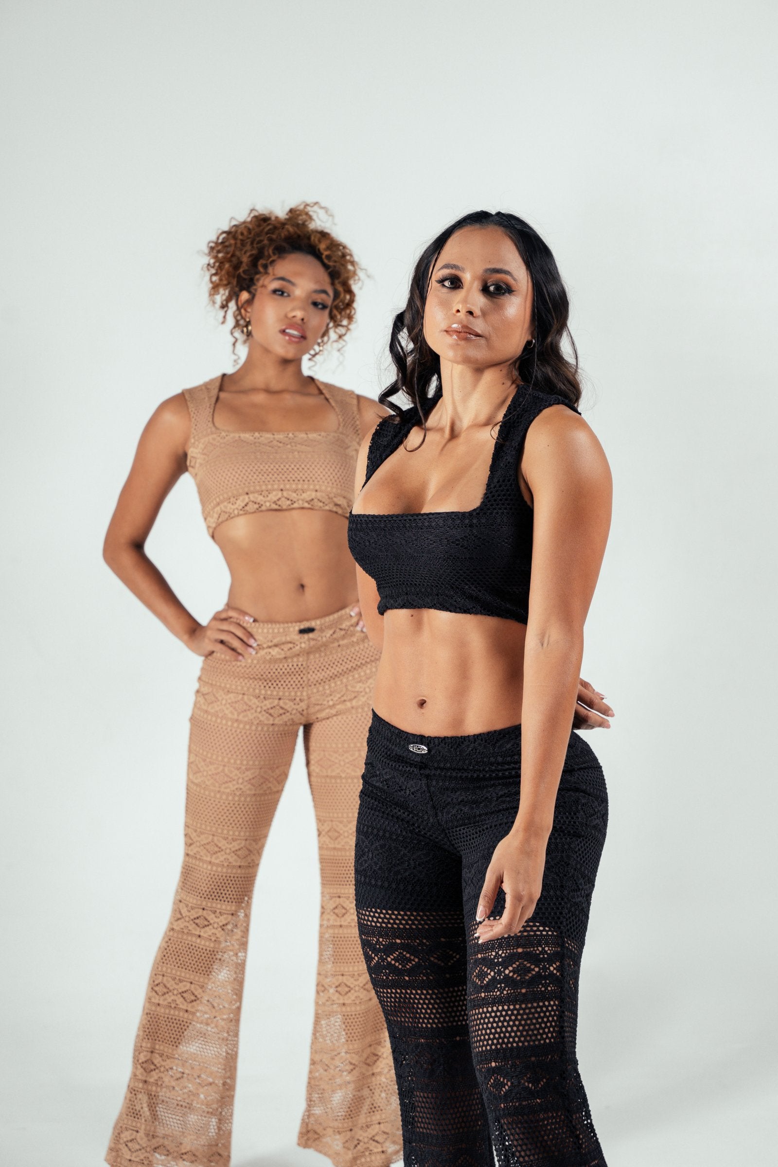 Elegant women’s crochet two-piece outfits, black and nude, showcasing stylish crochet fashion by Shacra. Perfect for summer or casual wear, highlighting trendy crochet sets.