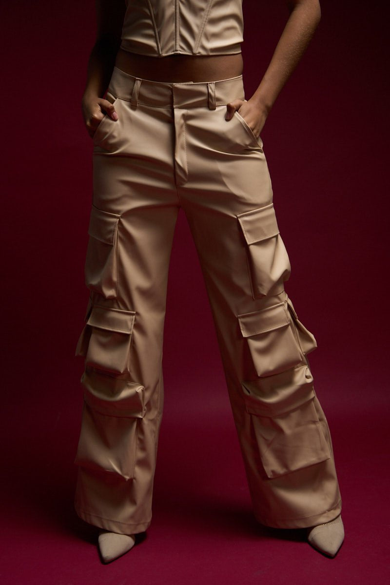 Luxurious beige satin cargo pants with multiple pockets, stylish and comfortable, perfect for trendy fashion looks and casual streetwear outfits.
