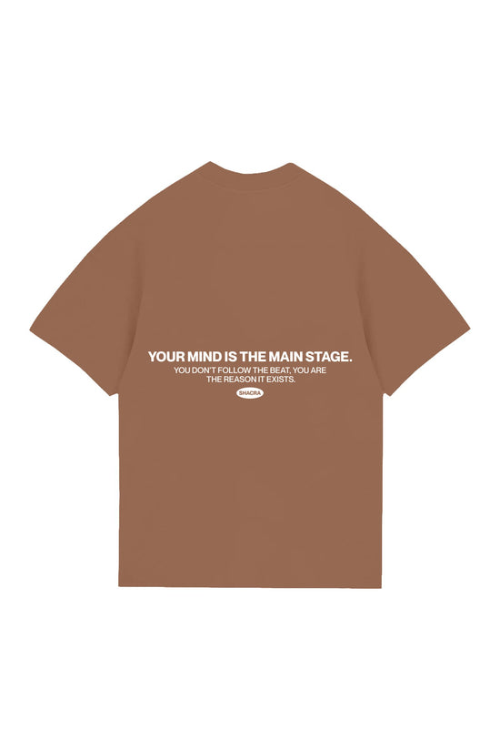 Inspirational brown T-shirt featuring motivational quote about mindset and focus, designed by Shacra for mindful streetwear and personal empowerment.