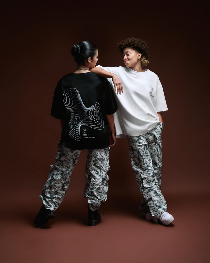 Comfortable streetwear casual outfits featuring graphic t-shirts with modern designs, paired with camouflage cargo pants for a bold urban style, perfect for fashion-forward lifestyles.