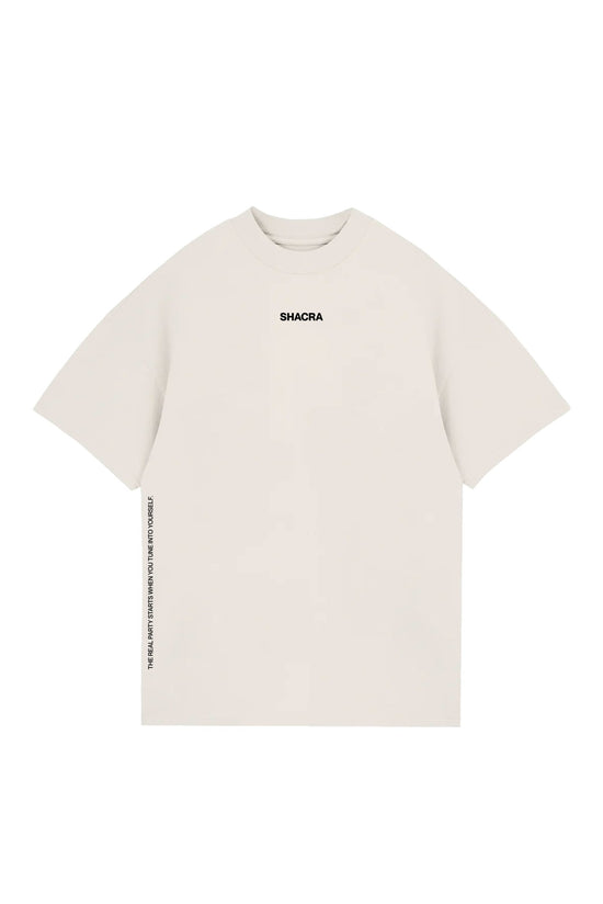 Minimalist white T-shirt with "SHACRA" logo in black and inspirational quote on the side, perfect for casual fashion and streetwear.