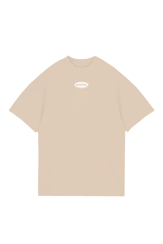 Oversized beige T-shirt with "SHACRA" logo on the chest, perfect for casual streetwear and comfortable fashion.