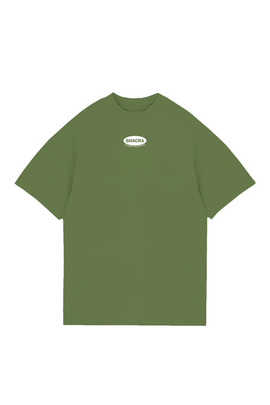 Vintage green oversized T-shirt with "SHACRA" logo and inspiring slogan, perfect for streetwear and casual fashion enthusiasts.
