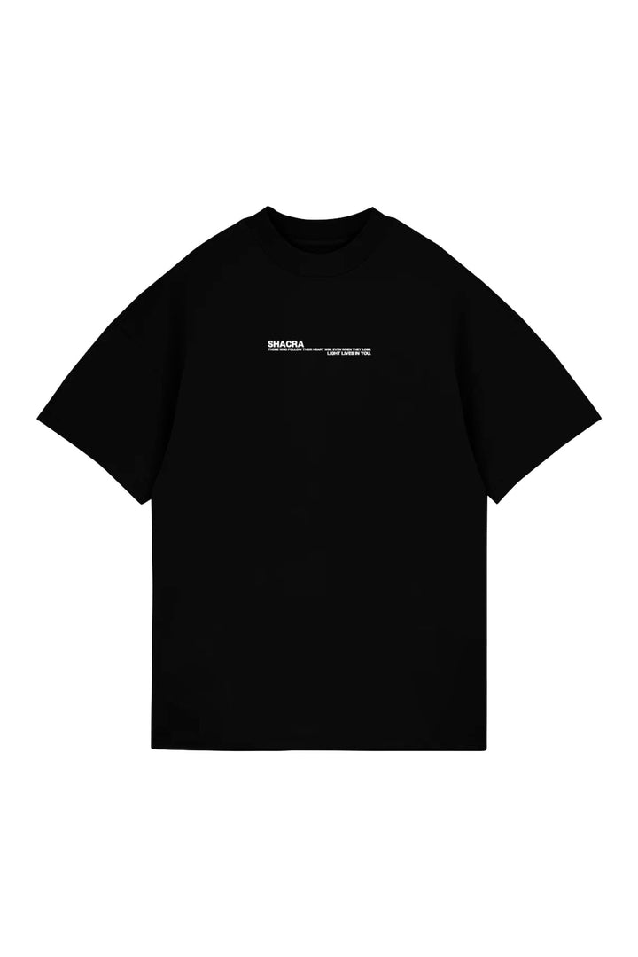 Black graphic t-shirt with white text design, inspired by Shacra fashion, featuring motivational message in minimalistic style. Perfect for streetwear and casual outfits.