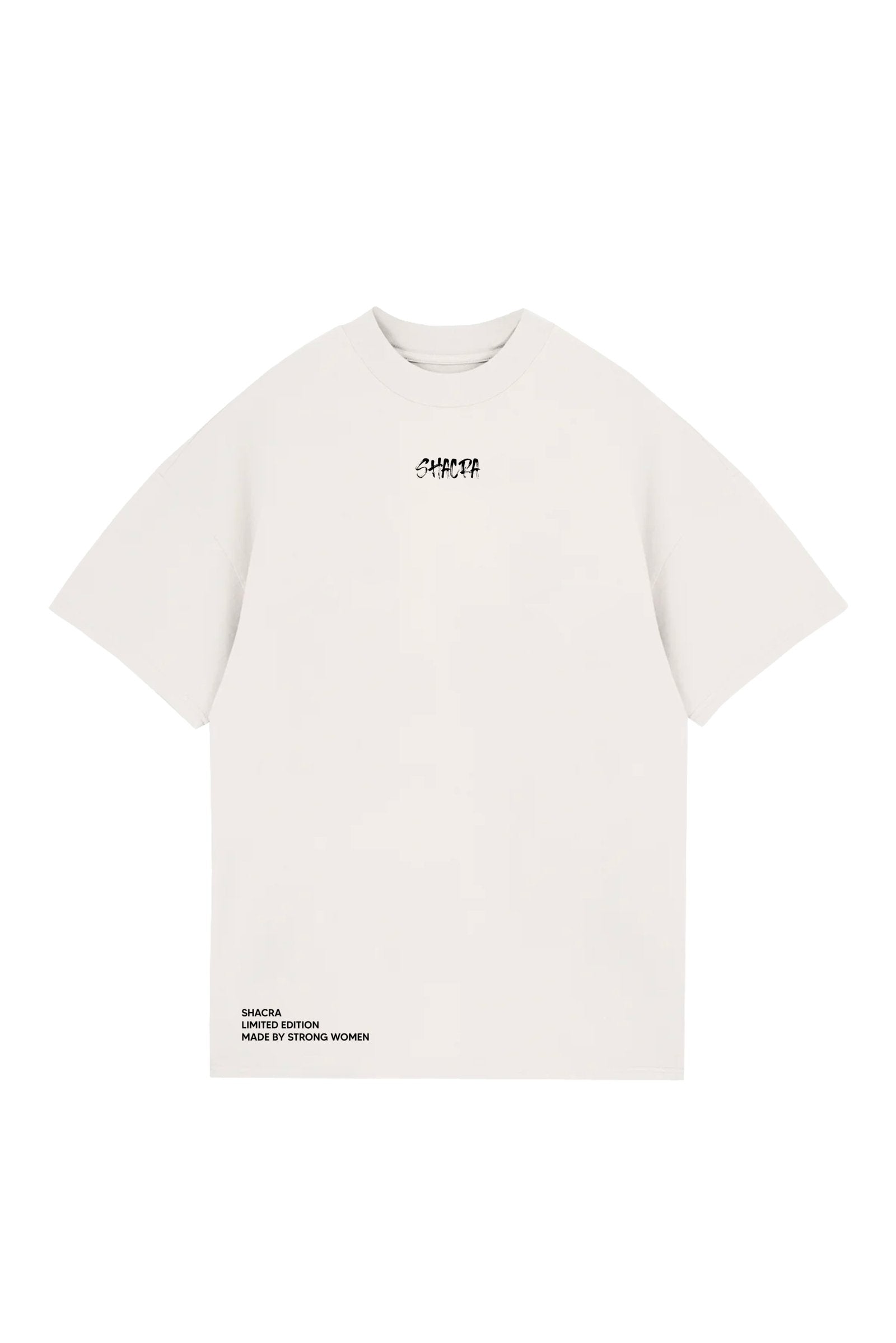 Bold white T-shirt with "SHACRA" logo in black text, oversized fit, made for women, reflecting strength and limited edition style from Shacra.