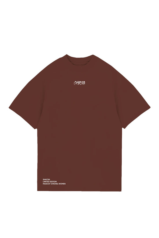 Bold brown T-shirt with "SHACRA" logo on the chest, designed for strong women, featuring a limited-edition style that combines fashion and empowerment. Perfect for casual wear and making a statement.